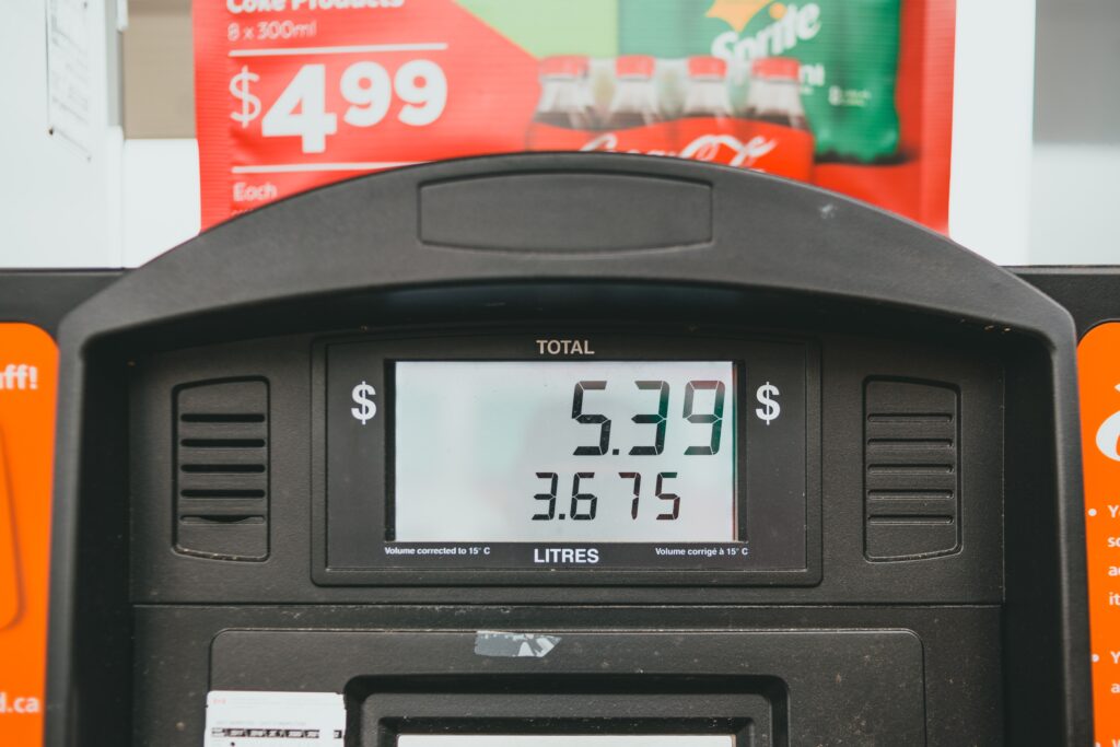 A petrol pump displays prices.