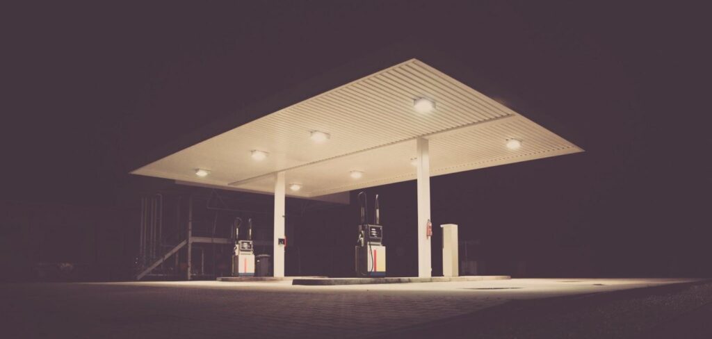 An empty petrol station at night.
